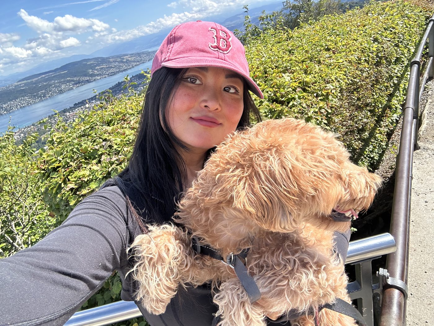 Gabriella and her dog Fran&ccedil;ois on a hillside path above Lake Zurich